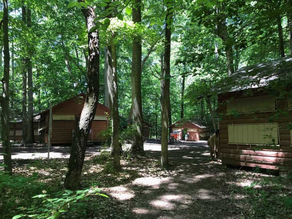 This photo features some of the wooden cabins in which campers at YMCA Camp Letts are accommodated throughout their time at the camp. Author’s own photo. 