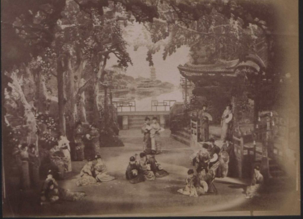 Smythe, J.A. “Photograph of Scene in the Mikado at Savoy Theatre, with 23 Figures, 13 Standing and 10 Sitting.” from “Photographs Registered at the Stationer's Company,” Page 563., Records of the Copyright Office of the Stationers' Company: Photographs, Jan.-Mar. 1886. Nineteenth Century Collections Online