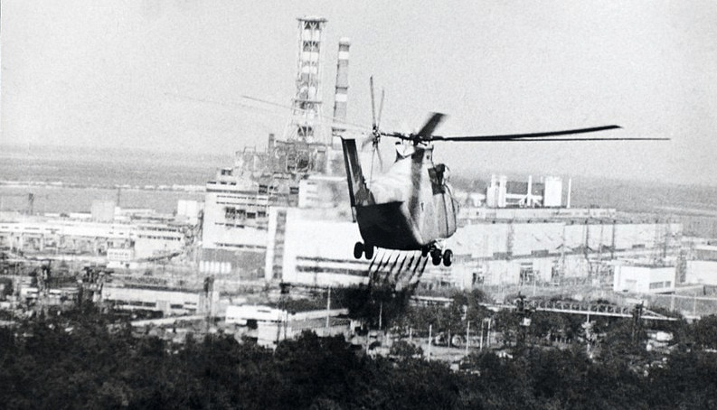 A helicopter sprays a decontamination liquid nearby the Chernobyl reactor in 1986. (Chernobyl, Ukraine, 13 June 1986), Historical collections of the Chernobyl accident from the Ukrainian Society for Friendship and Cultural Relations with Foreign Countries (USFCRFC).