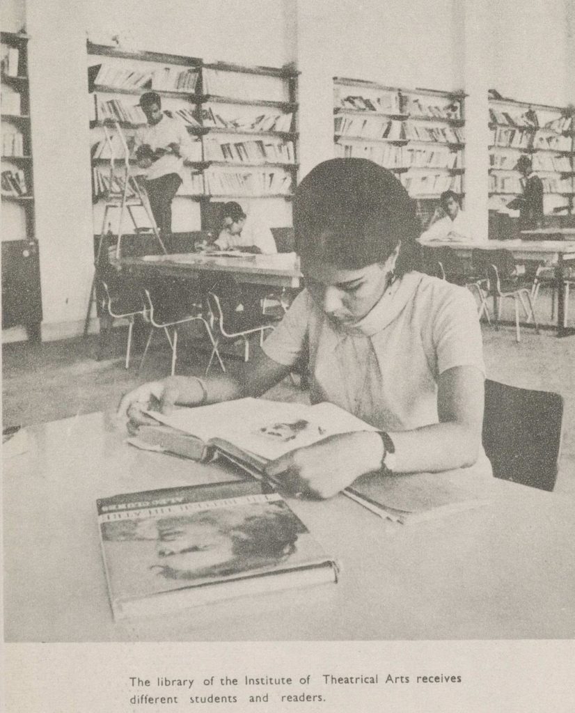 Student in library, reading, in Egypt. (Historic photo).