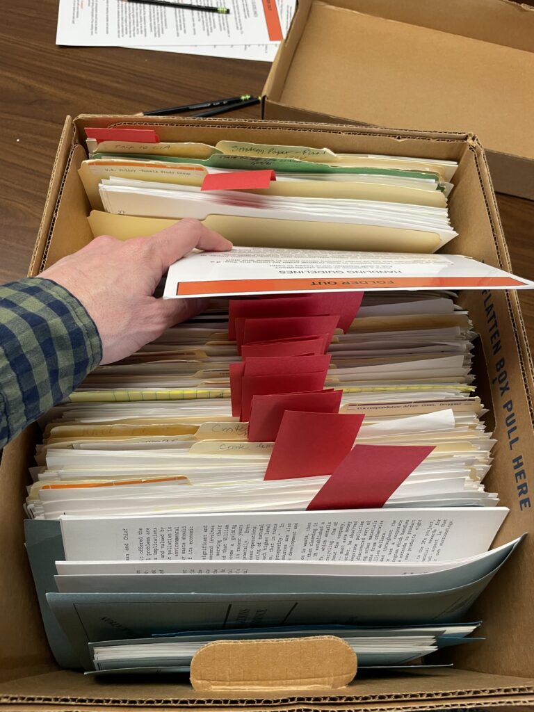 Assessing a box in the archive at Princeton University. © Rick Rychecky, 2025