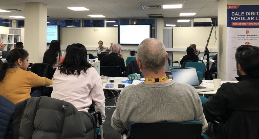 Participants listening to a team project presentation at the Hacking History Coventry hackathon